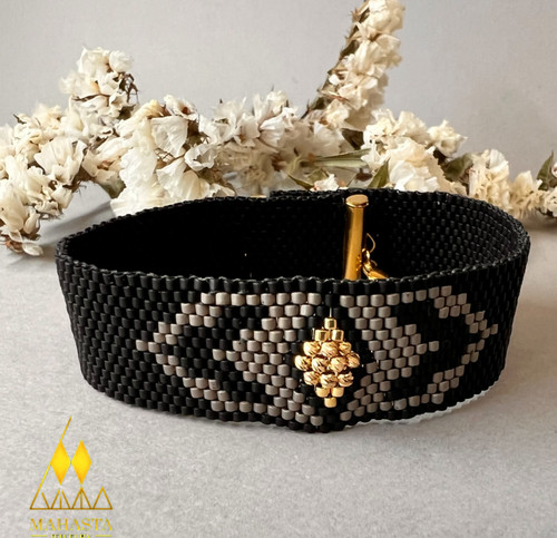 دستبندمیوکی مدل اسپرت مردانه تذکیب با گوی طلا طیف رنگ ( مشکی ، طوسی)