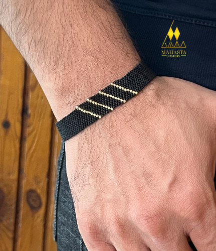 دستبند میوکی مردانه ترکیب با گوی طلا رنگ مشکی